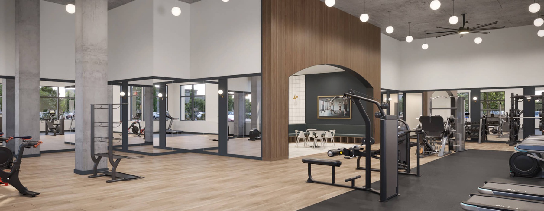 Spacious fitness room at Broadstone Saratoga with modern workout equipment and large windows