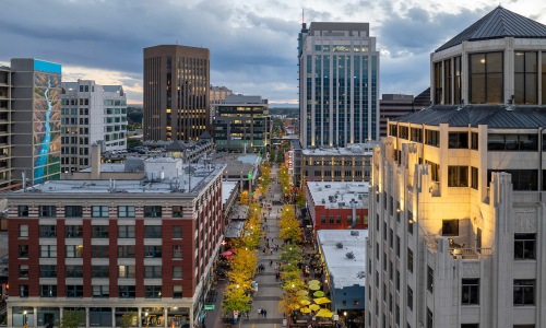 aerial shot of bustling neighborhood busy restaurants and shops