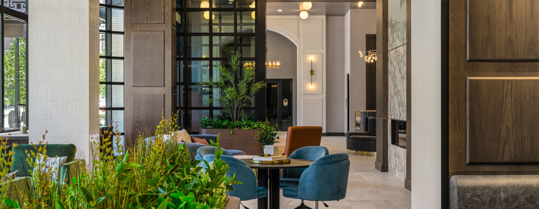 Lounge Seating at Broadstone Saratoga Stylish lounge at Broadstone Saratoga featuring modern seating, greenery accents, and a sophisticated open design.
