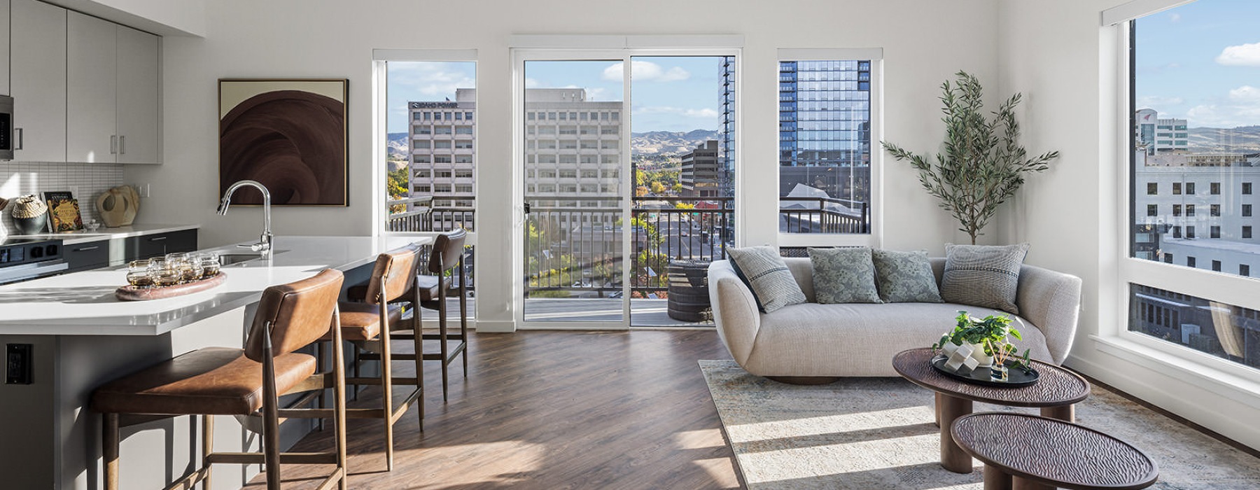 sunlit living room with access to private balcony