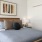 Bedroom with natural lighting and high ceilings