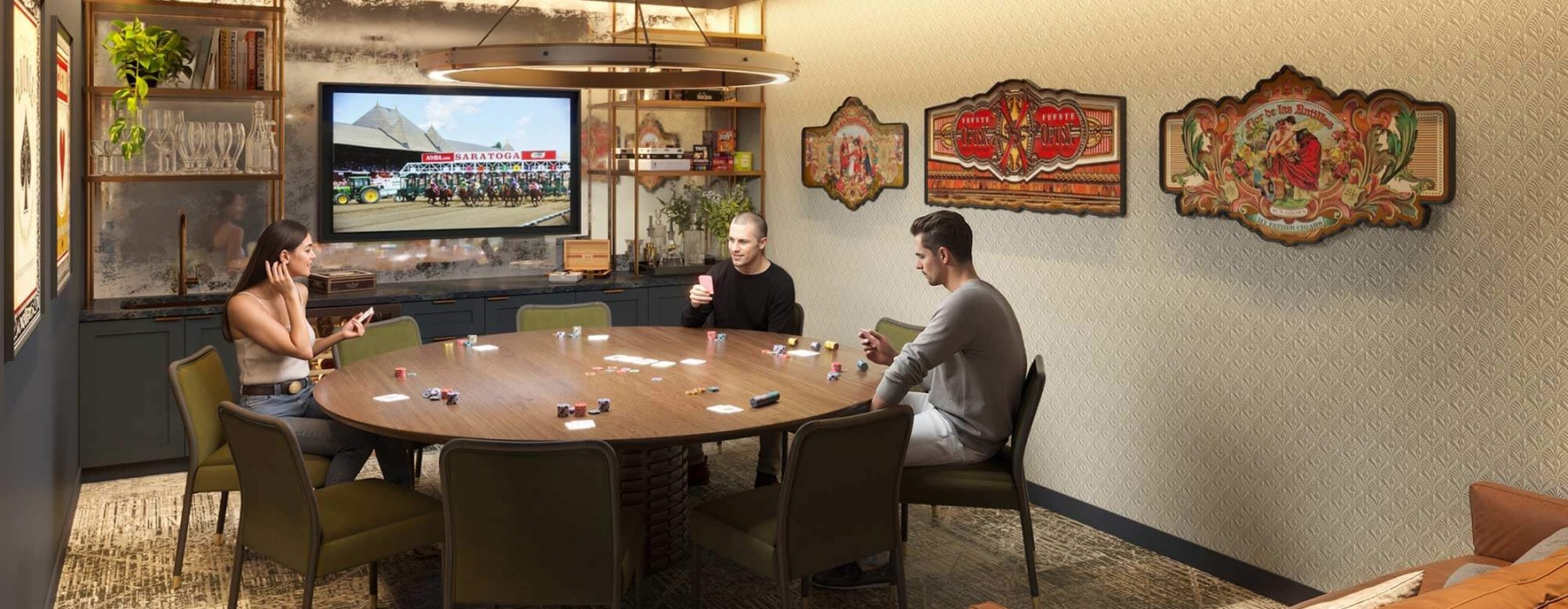 Cozy game room at Broadstone Saratoga with a round table, TV, and vintage decor.