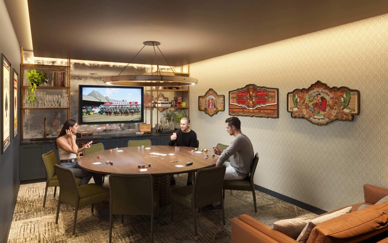 Cozy game room at Broadstone Saratoga with a round table, TV, and vintage decor.